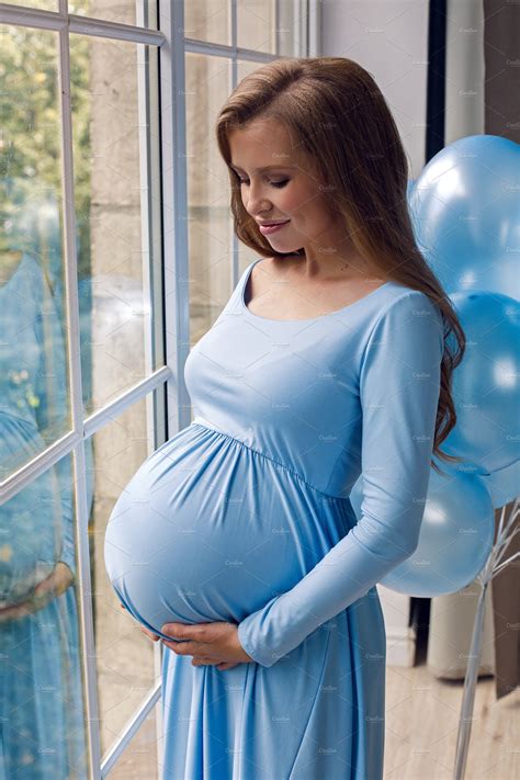 Beautiful Young Pregnant Girl In Blu Containing Pregnant Belly And Female People Images
