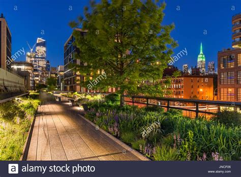 High Line Promenade At Twilight With City Lights And Illuminated