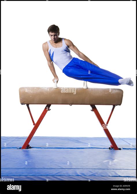 Male Gymnast Performing Routines On Vaulting Horse Stock Photo Alamy