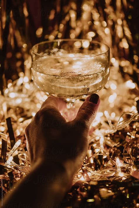Hand Holding A Glass Of Champagne By Stocksy Contributor Vera Lair Stocksy