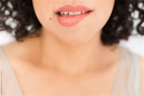 Up Close Of A Womans Beautiful Lips With Freckles On Them By Stocksy