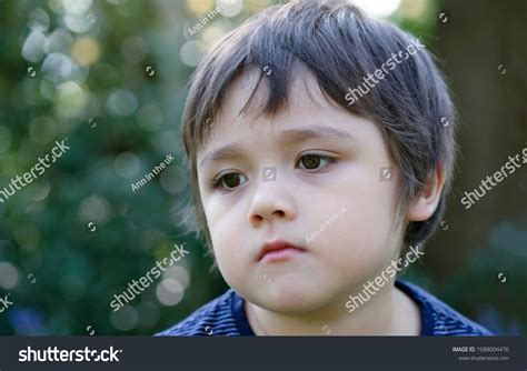 Portrait Upset Little Boy Sitting Alone Stock Photo 1088004476