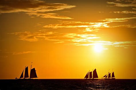 Boats Floating In The Atlantic Ocean At Sunset By Somacd