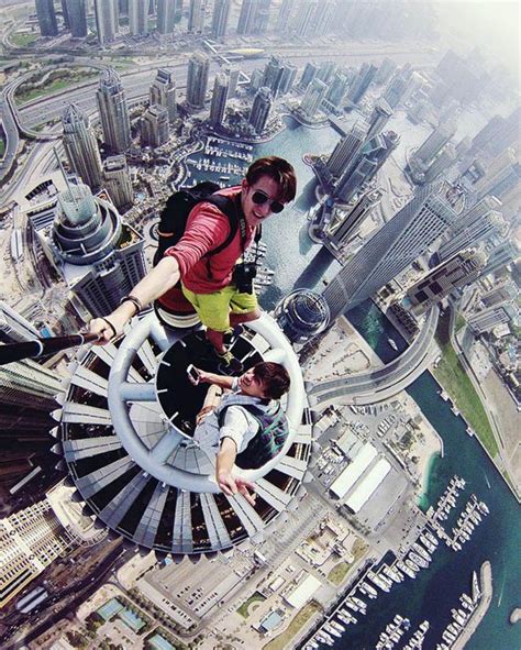 Daredevils Climb To The Top Of Worlds Tallest Towers In Quest For