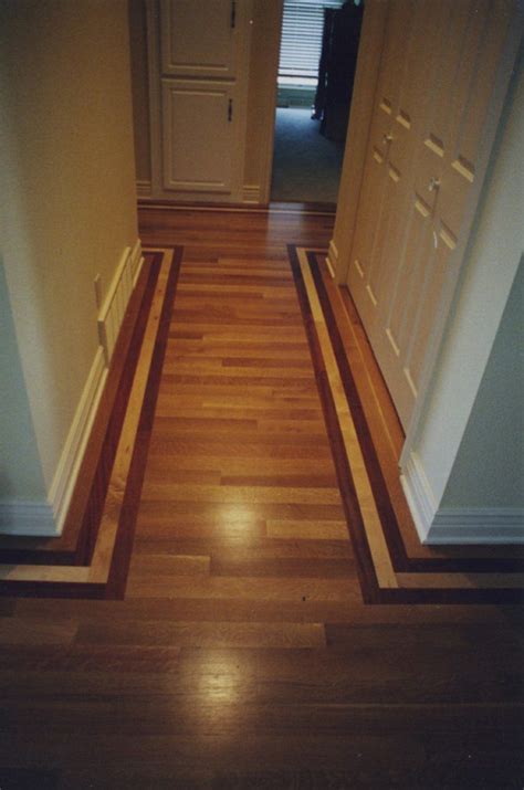 Running your hardwood planks from your main entrance toward the opposite wall will help simplify the sightline and makes the room appear less busy. Hallway floor where all the wood goes one direction ...