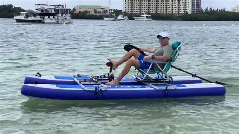 Inflatable Pontoon With Pedal Drive And Bicycle Mounted On Top Of 2