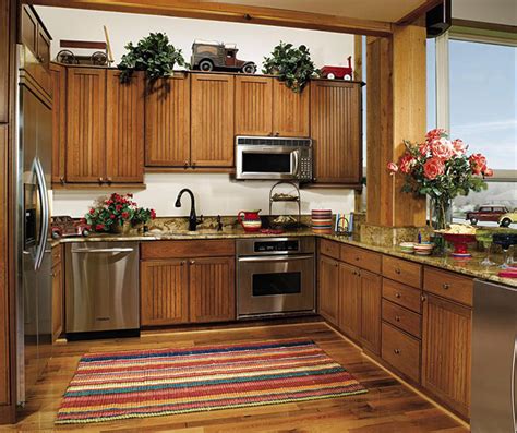 Beadboard is a traditional material that was once installed as separate boards. Beadboard Cabinets in Rustic Kitchen - Decora Cabinetry