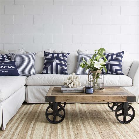 Our coastal furniture collection helps customers create a unique beach house feel whether it be a cottage by the sea, a lakeside retreat, oceanfront home or an abode dreaming of the sea. Beach Themed Coffee Table Decor | Roy Home Design