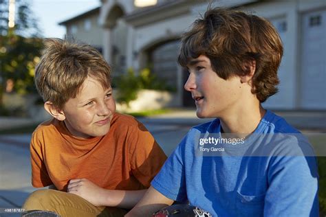 Two Boys Talking High Res Stock Photo Getty Images