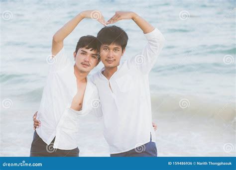 Homosexual Portrait Young Asian Couple Stand Gesture Heart Shape Together On Beach In Summer