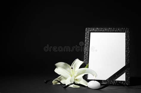 Funeral Photo Frame With Ribbon White Lily And Candle On Background
