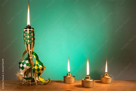 Conceptual Traditional Malay Torch And Lamp And Decorative Ketupat