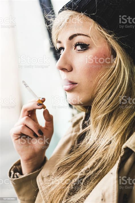 Woman Smoking A Cigarette Stock Photo Download Image Now