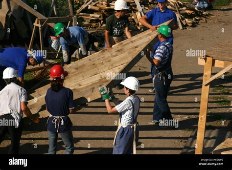 Group Of People Working Together On Construction Site Stock Photo Alamy