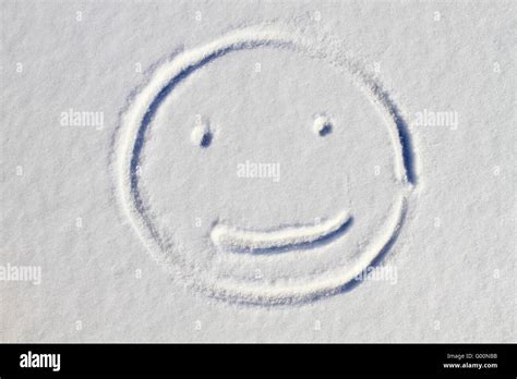 Smiley Face Drawn On Snow Background Stock Photo Alamy