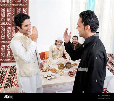Muslim men greeting each other Stock Photo - Alamy