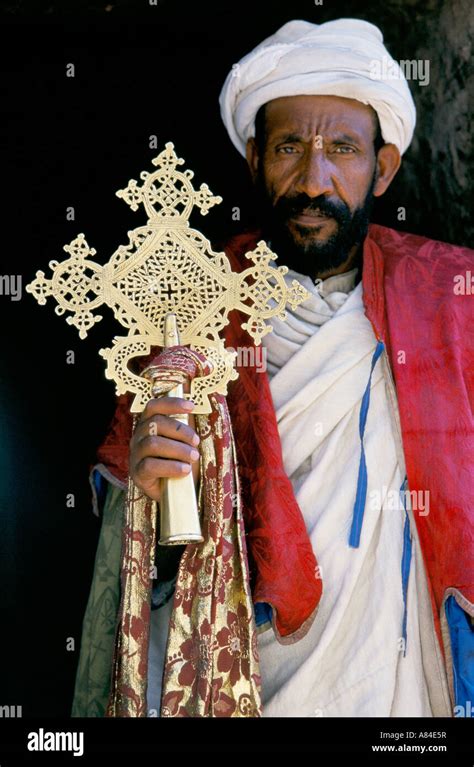 Ethiopian Orthodox Priest Outside A Church At Lalibela Holding An