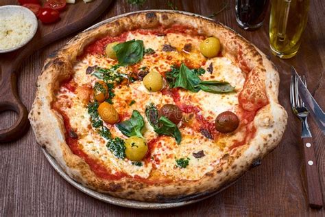 Pizza Napoli With Anchovies Basil And Olives Stock Photo Image Of