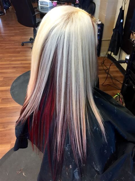 I wanted to do pink but everyone else does that and i like to be different. Platinum with red underneath and black peekaboos ...