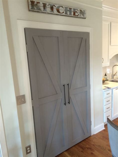 Barn door style pantry double doors | Tall cabinet storage, Style