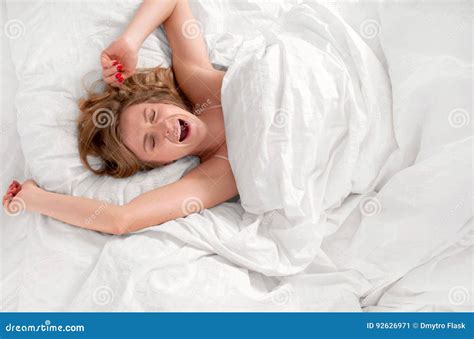 Woman Waking Up And Yawning After Sleep On Bed Stock Image Image Of Morning Gape 92626971