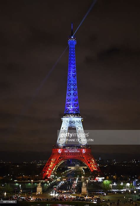The Eiffel Tower Is Illuminated With The Colors Of The French News