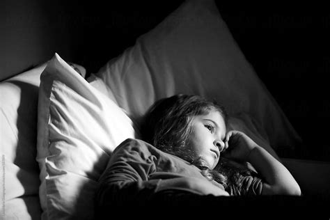 Sad Young Girl Laying In Bed By Dina Marie Giangregorio