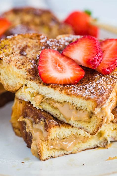 We love topping them with fresh berries, homemade whipped cream and warmed maple syrup but the options are endless. Almond Butter Stuffed French Toast | Food with Feeling
