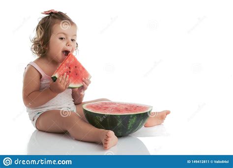 Baby Girl Eating Watermelon Slice Isolated On White