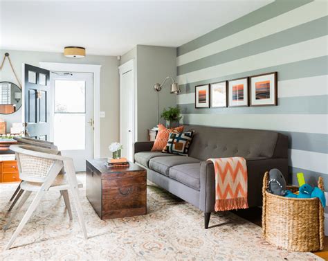If a living room is long and rectangular, painting an accent wall at the end of the room, the shorter wall, balances the awkward length of the side walls. Light Gray Silver And Red Accent Wall - Modern House