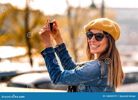 A Woman Taking Pictures In A City Park Stock Image Image Of People