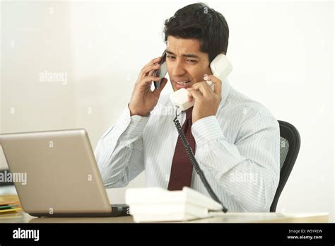 Man Using Landline Phone In Hi Res Stock Photography And Images Alamy