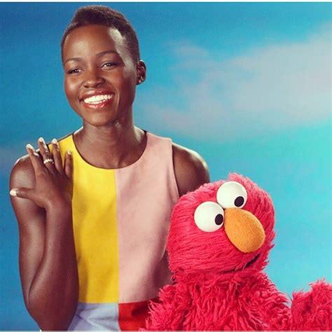 lupita nyong o makes an appearance on sesame street why she and elmo love the skin they re in