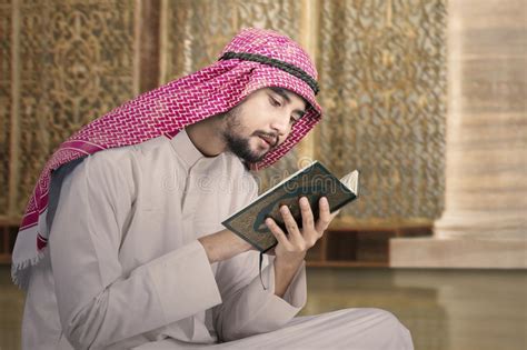 Muslim Man Sits In Mosque And Reads Quran Stock Photo Image Of Arab