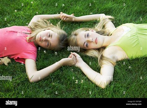 Beautiful Teen And Tween Sisters Holding Hands Stock Photo Alamy