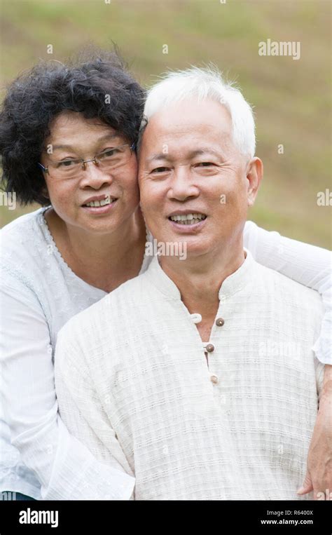Old Asian Couple Relaxing Outdoor Stock Photo Alamy