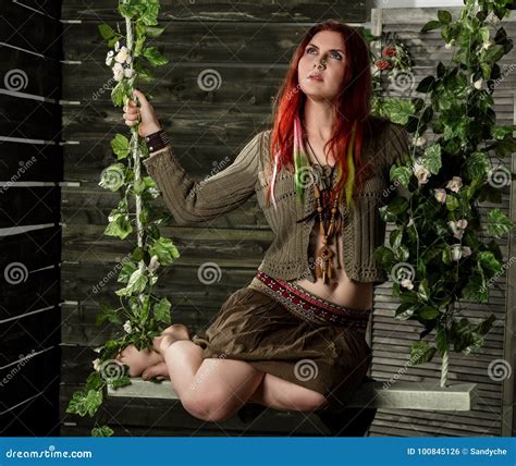 Young Hippie Boho Redhead Woman Having Fun On A Swing Hippie Style On
