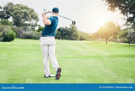 Golf Back And Hobby With A Sports Man Swinging A Club On A Field Or