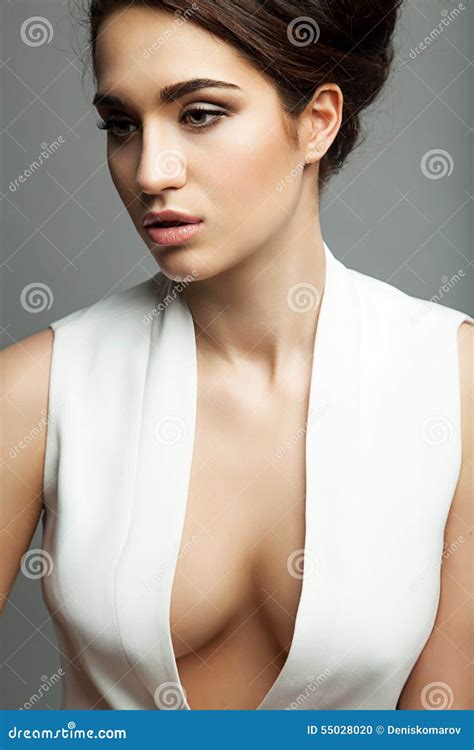 Woman In A Dress With A Plunging Neckline Stock Photo Image Of Eyes