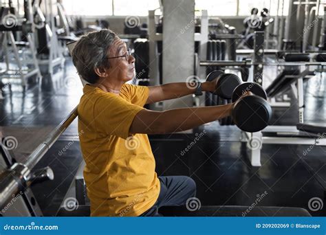 Fit Old Man Lift Dumbbell And Stretch Arms In Gym Stock Image Image