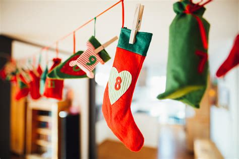 Red And Green Christmas Stocking Hanging Inside Room · Free Stock Photo