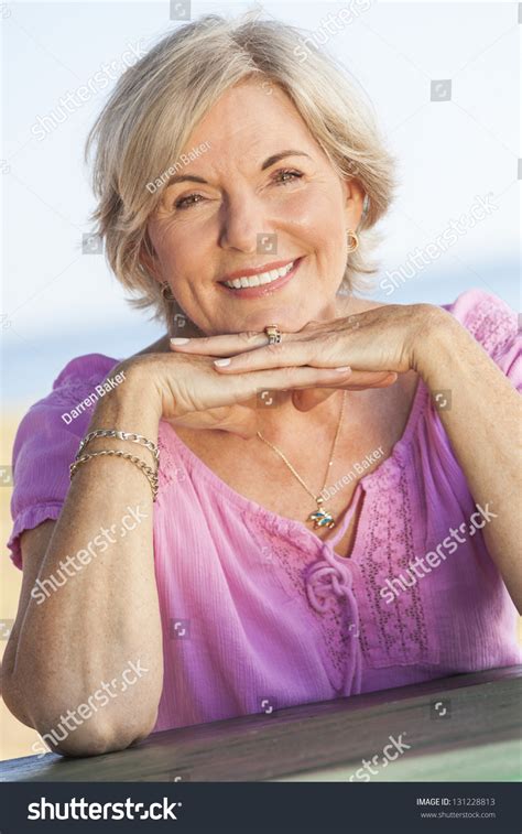 Outdoor Portrait Of An Attractive Elegant Classy Senior Woman Happy