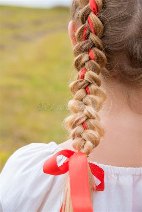Russian Girl Slavic Appearance With Braids With Red Ribbons In The