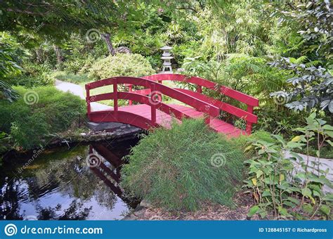 A Small Red Wooden Bridge In A Japanese Garden Stock Image