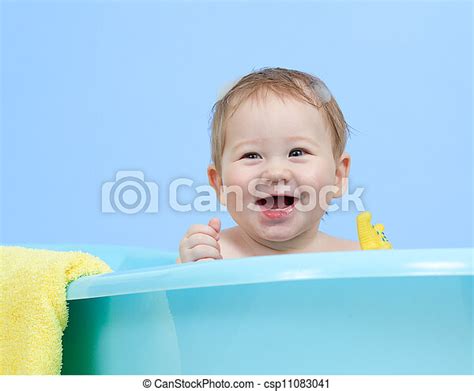 Adorable Baby Taking Bath In Blue Tub Adorable Baby Boy Taking Bath In