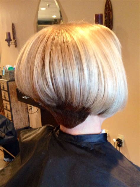 The bangs are cut straight across rather than as a swoop bang, giving this cut a young, trendy look. Stacked inverted bob | Bobs haircuts, Bob hairstyles ...