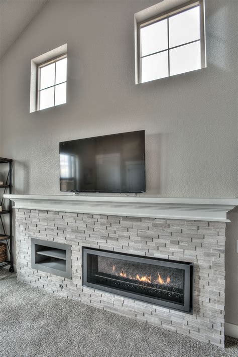 We built this faux fireplace surround out of one sheet of plywood, and it only cost to see this faux fireplace mantel transform into a witches mantel for halloween be sure to check it out on the home. Linear Fireplace with Ledgerstone in 2019 | Linear ...