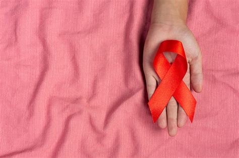 Free Photo Woman Hand Holding Red Ribbon Hiv Awareness Concept World Aids Day And World Sexual