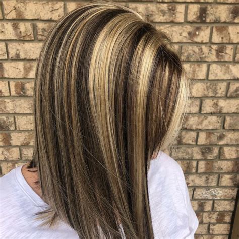 A beachy blend of medium brown hair with highlights is perfect for the summer. "Fine woven wisps are out and bold, high contrast - a ...