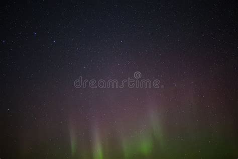 Beautiful View At The Northern Lights In The Night Sky Stars In The